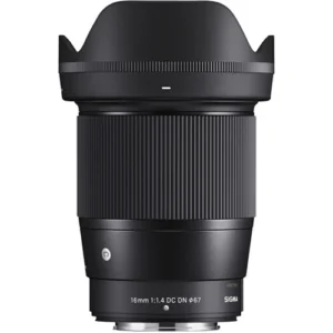 Combining a comfortable wide-angle design with an ultra-fast maximum aperture, the 16mm f/1.4 DC DN is part of Sigma's Contemporary series of lenses and designed for use with Nikon Z-mount mirrorless cameras. Characterized by its bright f/1.4 maximum aperture, this lens is adept at working in low-light conditions and also affords increased control over depth of field for selective focus control. The optical design makes use of several low dispersion and aspherical elements, which control color fringing and various aberrations in order to provide high sharpness and clarity throughout the aperture range. Individual elements also feature a super multilayered coating to suppress flare and ghosting for greater contrast and color fidelity when working in strong lighting conditions. Benefitting the optical assets, this lens also sports a stepping AF motor for quick, quiet, and smooth focusing performance that suits both still photography as well as video applications. As part of the Contemporary line within Sigma's Global Vision series, this lens is designed to achieve a balance between convenience and performance, and meshes a compact, lightweight build and versatile handling with notable optical attributes. Wide-angle prime is designed for APS-C-format Nikon Z-mount mirrorless cameras and provides a 24mm equivalent focal length. Bright f/1.4 maximum aperture excels in low-light conditions and also affords increased control over depth of field for achieving selective focus effects. Two special low dispersion (SLD) elements and three F low dispersion (FLD) elements reduce color fringing and chromatic aberrations in order to achieve greater clarity and color accuracy. Two aspherical elements are used to limit distortion and spherical aberrations and also contribute to greater overall sharpness and accurate rendering. A super multilayered coating has been applied to lens elements in order to minimize lens flare and ghosting and contribute to producing contrast-rich and color-neutral imagery, even in backlit conditions. A stepping AF motor benefits both photographers and videographers with its fast, precise, and near-silent performance. Rounded nine-blade diaphragm contributes to a smooth and pleasing bokeh quality. The bayonet mount is constructed from brass to ensure accuracy and durability. Additionally, rubber sealing in the mount design renders it dust and splash resistant.